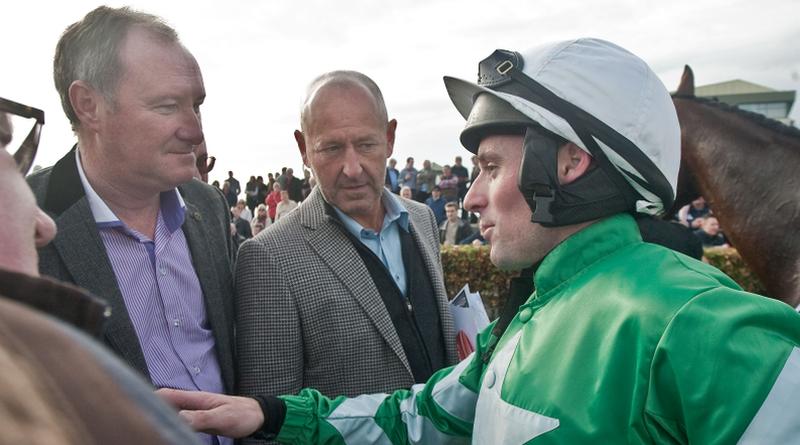 Jockey Seán Flanagan in conversation with Galway trainer Patrick Kelly and owner Philip Reynolds after Presenting Percy won the Corrib Oil Maiden Hurdle at Ballybrit on Sunday. Photos: Iain McDonald.