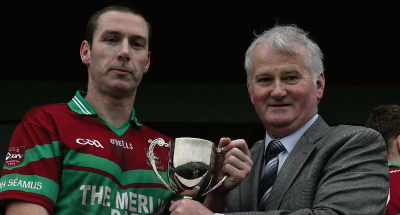 GAA Presidential candidate Frank Burke is pictured presenting the Connacht intermediate football cup to St James' captain Mark Kelly in November of 2010.