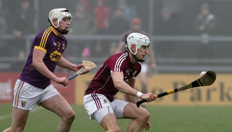 Galway attacker Jason Flynn secures possession ahead of Wexford's Liam Ryan during Sunday's National Hurling League tie at Pearse Stadium.