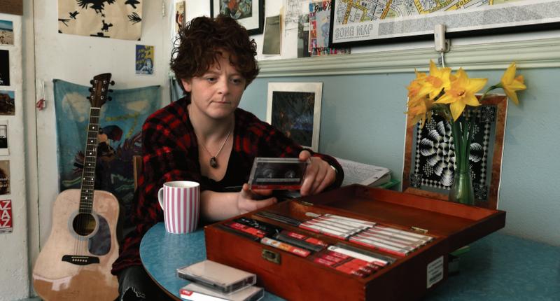 Emma O'Grady with her grandfather's tapes. “He was a difficult man. He didn’t speak much and seemed to live in his head a lot. He might be in a room but wouldn’t join in the conversation," she says. Photo: Joe O'Shaughnessy.