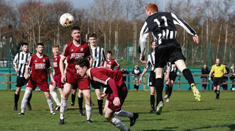 Galway Hibernians' Ronan Glynn gets in an attacking header in his club's Premier Division match with Athenry F.C. on Sunday. Watching the outcome are Athenry players Jamie O'Driscoll, Paddy Quinn, Declan Cullen, Dan Cunningham and (foreground) Gary O'Connell with Hibernian players Evan Deacy and Nathan Ward. Photos: Eirefoto.