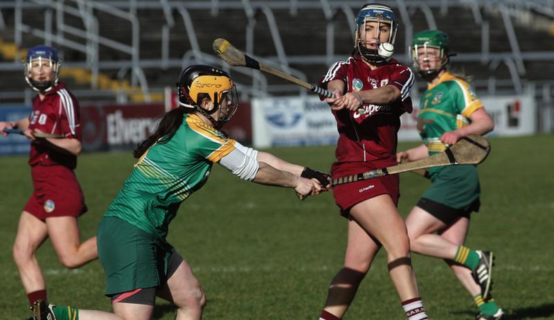 Galway’s Noreen Coen looks to get her shot away as Meath full-back moves in to block. Photos: Enda Noone.
