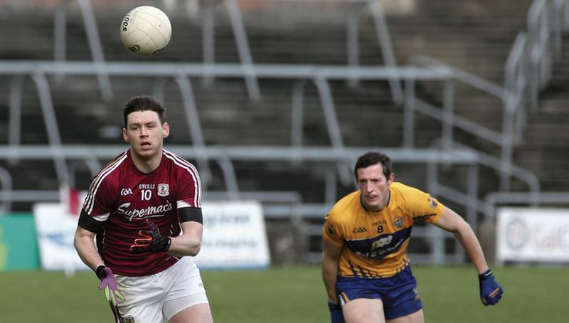 Galway half forward Thomas Flynn is about to secure possession ahead of Clare's Cathal O'Connor during Sunday's National Football League tie at Pearse Stadium. Photo: Joe O'Shaughnessy.