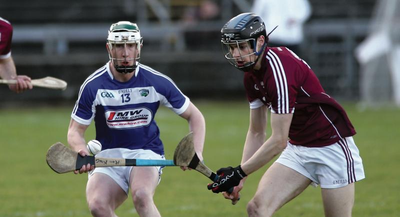 Galway defender Sean Loftus is about to secure possession against Ross King of Laois during Sunday's National Hurling League tie at Pearse Stadium. Photo: Joe O'Shaughnessy.