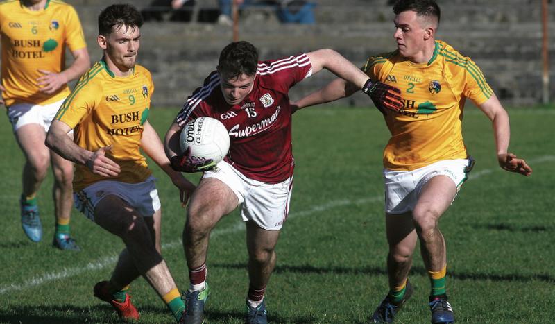 Galway’s Dessie Conneely breaks through the challenges of Letrim’s Mark Plunkett and James Mitchell during the Connacht U-21 Football Championship at Tuam Stadium on Saturday. Photos: Enda Noone.