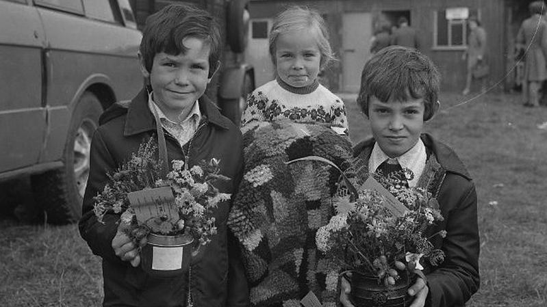 Mark, Gabriel and Frank Donnellan, Ballinasloe, display their prize exhibits at the Ballinasloe Fair in October 1975.