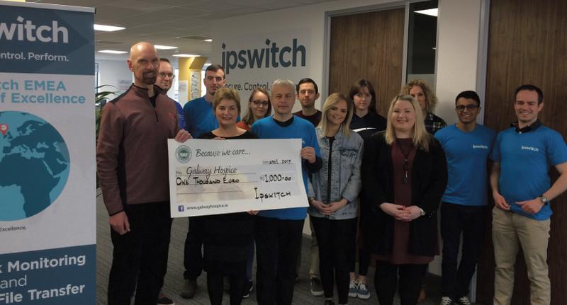 Mary Tierney of Galway Hospice accepts a cheque from Ipswitch executives Joe Krivickas and John McArdle, joined by the rest of the Ipswitch Galway team.