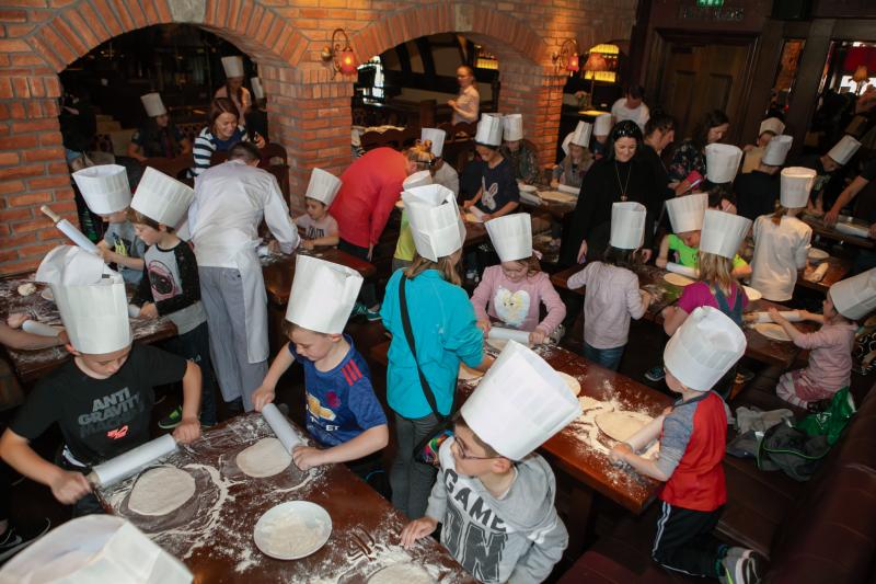 Children learn the art of making their own pizzas at Sheridan's pizza-making masterclass as part of Galway Food Festival