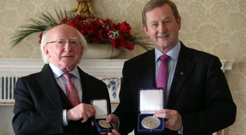 Enda Kenny receives the Seal of the Taoiseach and Seal of Government from President Michael D. Higgins at Aras an Uachtarain one year ago this week.