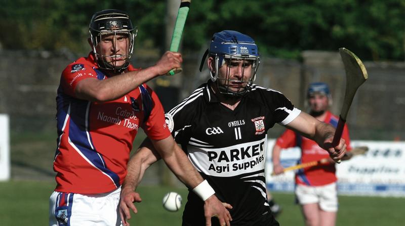 St Thomas' Kenneth Burke and Colm Raftery of Padraig Pearses in a tussle for possession in Duggan Park at the weekend. Photos: Enda Noone.