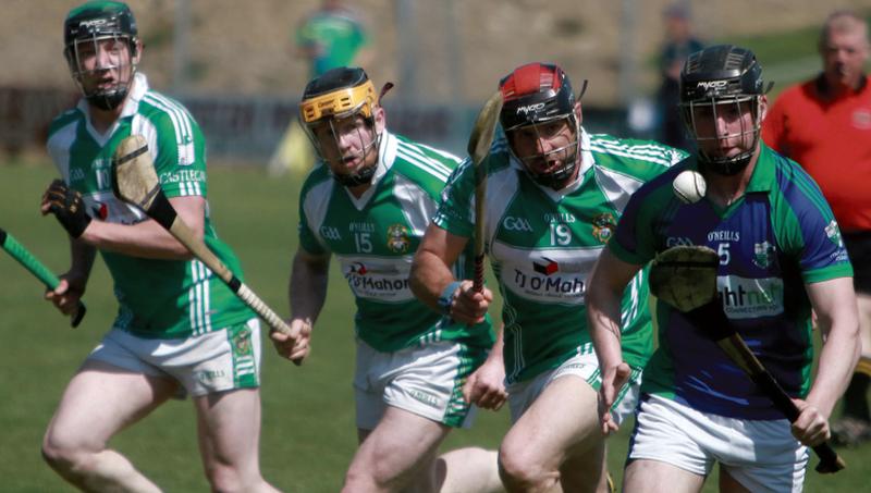 Kevin Moloney of Tynagh-Abbey-Duniry gathers possession as the Castlegar trio of Mike Fahy, Enda Concannon and Martin Cullinane give chase in Loughrea on Sunday. Photos: Hany Marzouk.