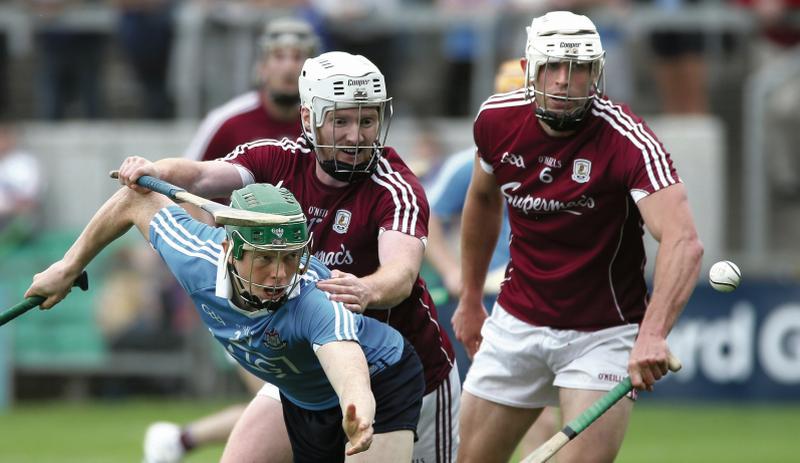 Galway's John Hanbury and Gearóid McInerney getting to grips with Dublin's Fergal Whitely during the Leinster quarter-final in Tullamore on Sunday. Photo: Joe O'Shaughnessy.