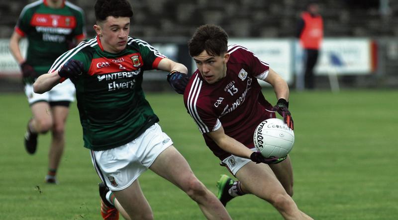 Galway's Rory Cunningham peels away from the challenge of Mayo's Jack Coyne during the Connacht Minor Football Championship at McHale Park, Castlebar. Photos: Enda Noone.