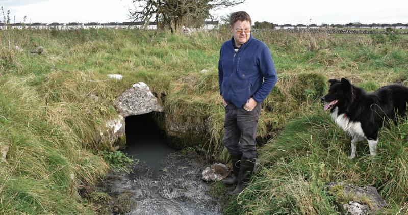 Tuam farmer Tommy McDonagh at the stream running through his land at Kilcloghans which is polluted. Photo: Johnny Ryan Photography.