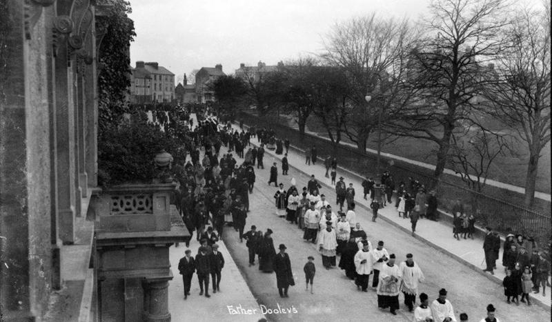 The funeral of Fr Peter Dooley, Parish Priest of the united parishes of St Patrick’s and the Abbey from 1869 to his death in 1911. The funeral is pictured passing down the western side of Eyre Square. Born at Culliagh near Headford in 1836, Fr Dooley was a man of the people. He was instrumental in helping to found the Galway Woollen Mills in Newtownsmyth, as well as a hosiery factory in Francis Street, both giving much-needed employment to the area. He built the Temperance Hall in Lombard Street, and provided much social housing in the Woodquay and Sickeen areas of the city without any government aid.