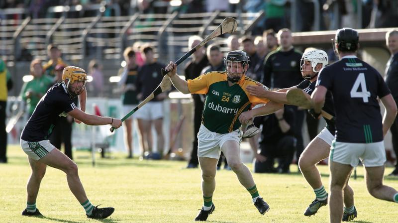 Craughwell's Brian Callanan tries to find a way past the Liam Mellows duo of Kevin Lee and Mark Hughes. Photos: Joe O'Shaughnessy.