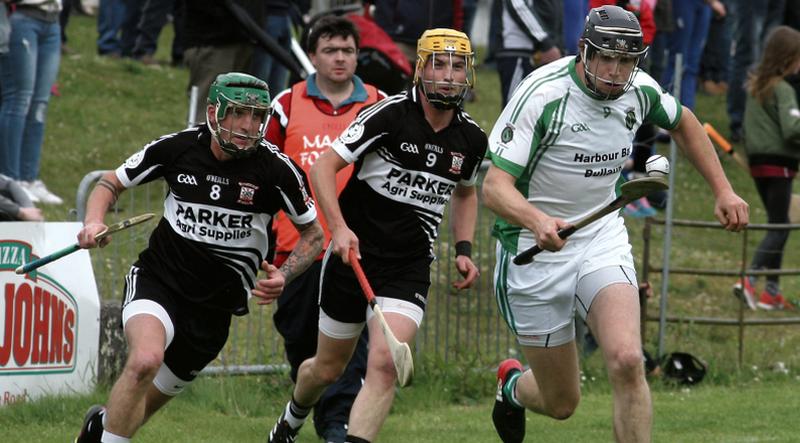 Sarsfields Joseph Cooney races away with possession as the Padraig Pearses duo of Kerril Hardiman and Sean Hardiman give chase. Photos: Enda Noone.