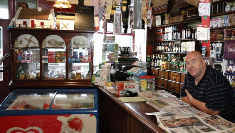 Dessie O'Brien at the counter of his unique shop in Kilrickle. “I don’t see our customers as locals, they are friends,” he says. Photos: Hany Marzouk.