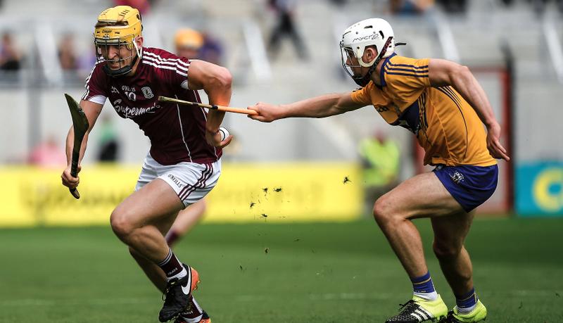 Galway's Seán Bleahane taking on Clare's Ross Hayes during Saturday's All-Ireland minor hurling quarter-final at Páirc Uí Chaoimh. Photos: Ray McManus/Sportsfile