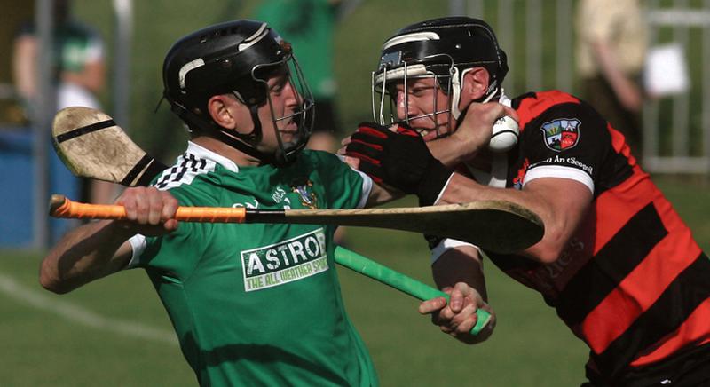 Liam Mellows' Brian Leen taking a strong challenge from Cappataggle’s Damien Joyce during the clubs' senior hurling championship tie in Loughrea on Saturday evening. Photos: Enda Noone.