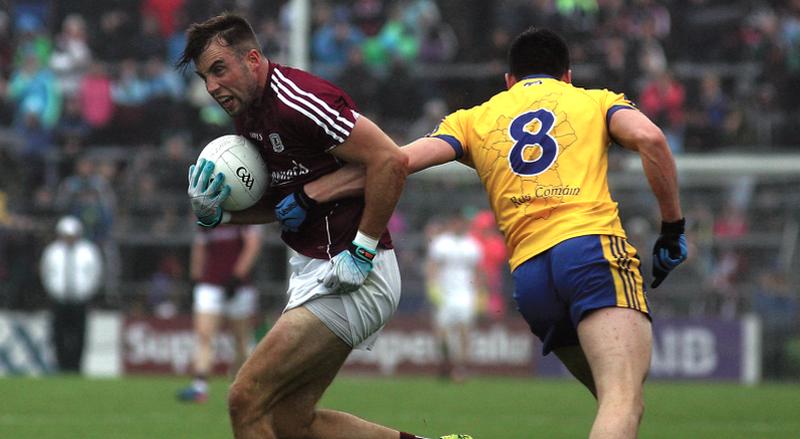 Galway midfielder Paul Conroy comes under pressure from Roscommon's Tadhg O'Rourke during Sunday's Connacht senior football final at Pearse Stadium. Photo: Enda Noone.