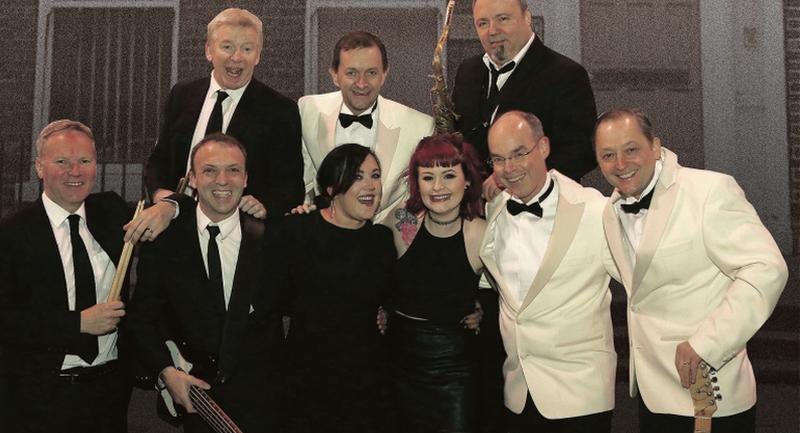 The Stars of the Commitments with Kenneth McCluskey second from left with guitar.