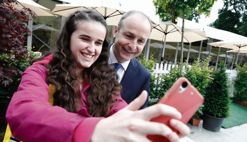 In full Bloom...Fianna Fail leader Micheal Martin with Orla Moloney from Loughrea at the recent garden festival. Is he the one to grow most after the next election?