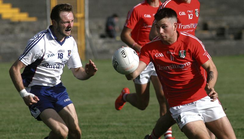 Tuam Stars Joseph Lowry prepares to take on Caherlistrane's Sean Kyne during Saturday's senior football championship encounter Tuam Stadium. Photos: Enda Noone.
