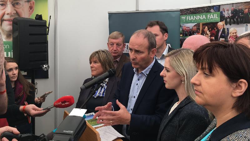 Fianna Fail leader Micheal Martin at this week's National Ploughing Championships, joined by among others Deputy Ann Rabbitte - and watched over by Eamon Ó Cuív!