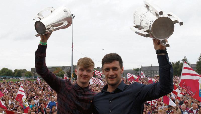 Galway minor captain Darren Morrissey with the Irish Press Cup and David Burke with the Liam Mc Carthy in Ballinasloe. Photo: Gerry Stronge