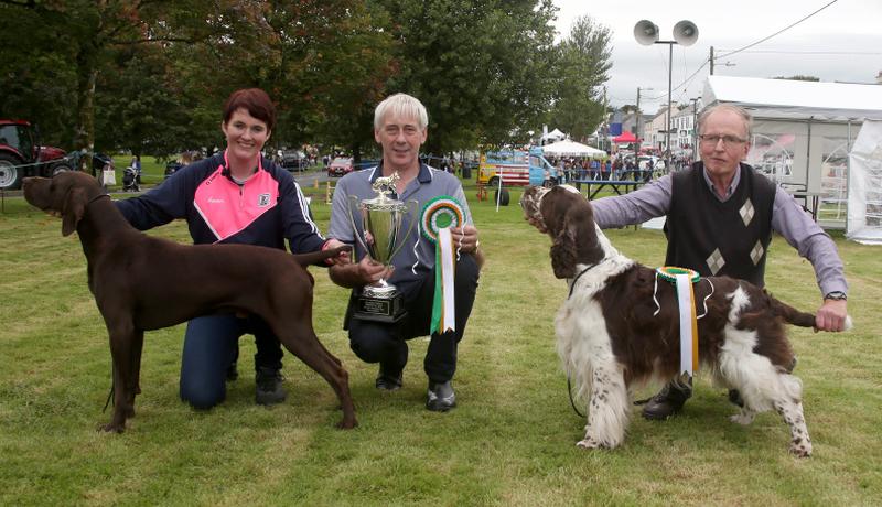 Chairperson of the Monivea Fair, Martin O'Brien, presenting Martina Kearney from Headford with the Martin O'Brien Cup for winning the Champion Dog of the Show. Also in picture is Seamus Fallon from Tuam, who took the Reserve Champion accolade. Photo: Hany Marzouk.