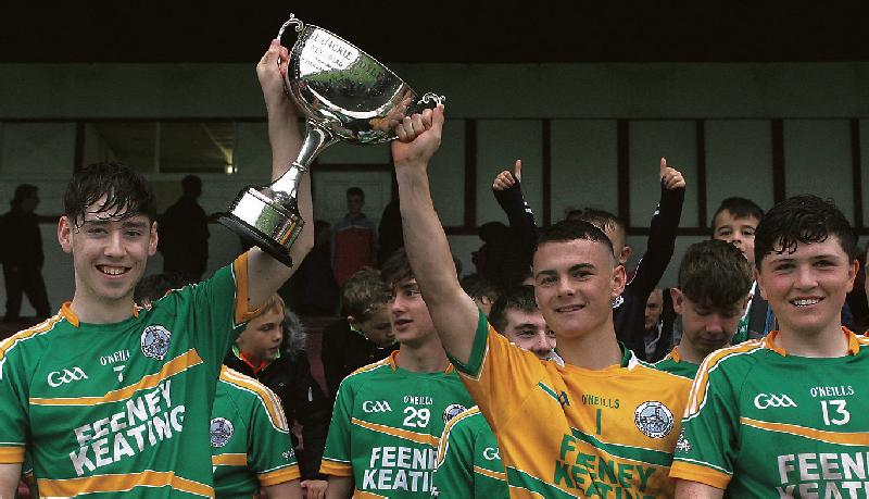 Claregalway captain Luke Roche and goalkeeper Mark King raise the cup aloft after their North Board Minor A Final win over Monivea/Abbey at Tuam Stadium on Saturday.