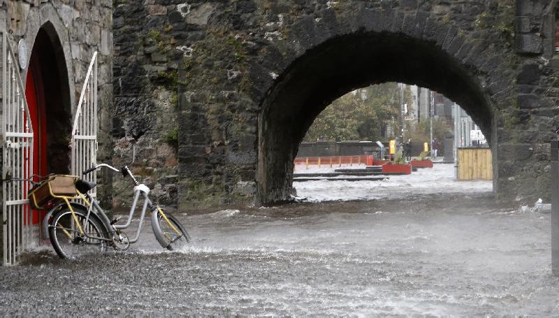 Eye of the storm . . . Flooding mightn't have been an issue for most places during ex-hurricane Ophelia last Monday but this wasn't the case at the Spanish Arch area of Galway city where sea surges flooded the streets in the afternoon coinciding with the high tide. PHOTO: HANY MARZOUK.