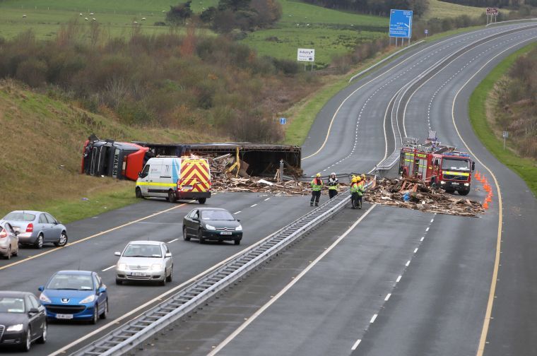 The aftermath of the accident in which an articulated truck veered across the central barrier before overturning on the M6 near Ballinasloe on Monday. Photo: Hany Marzouk.