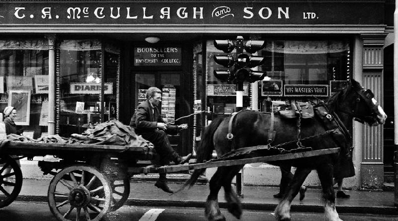 PJ Ruane and his horse and cart pass by McCullagh's book and record shop in Williamsgate Street, Galway in December 1966.