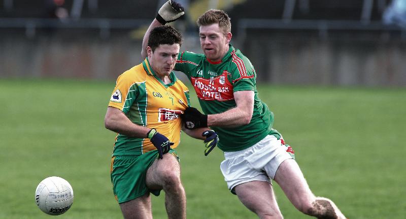 Corofin's Dylan Wall comes under strong pressure from Darren Dolan of St Brigid's during Sunday's Connacht Club football semi-final at Tuam Stadium. Photo: Joe O'Shaughnessy.