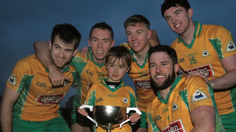 Corofin players Cathal Silke, Jason Leonard, Dylan McHugh, Conor Cunningham and Colin Brady, with young supporter Luke Treacy, celebrating with the Shane McGettigan Cup after their Connacht Senior Club Football Final triumph at Tuam Stadium on Sunday. Photo: Enda Noone.