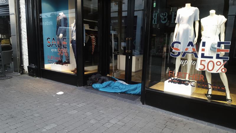 A homeless man sleeping rough in a doorway on Shop Street this week. Roscommon hurler Alan Moore is organising the ‘Gaelic Voices for Change’ sleep-out in Galway City on December 16 to highlight the homelessness crisis.