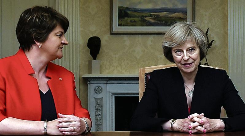 I'll be watching you...DUP leader Arlene Foster keeps a close eye on British Prime Minister Theresa May.