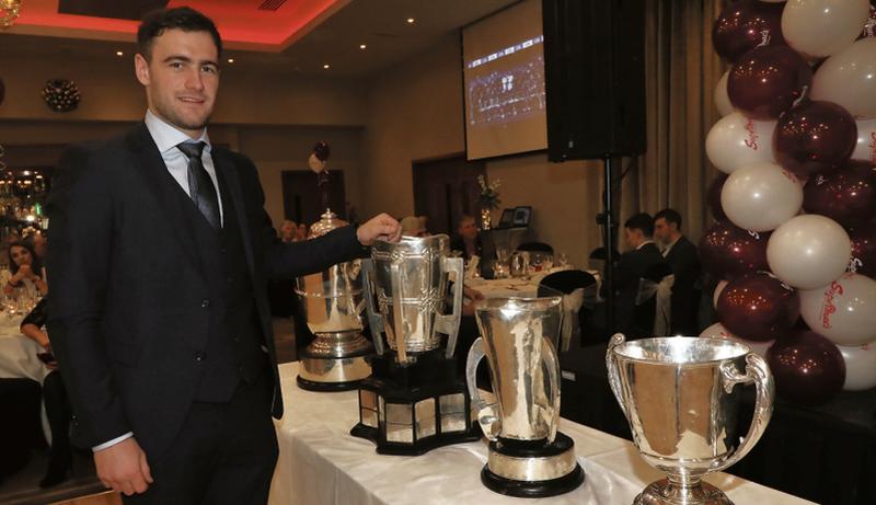 Galway senior hurling captain David Burke proudly stands beside the four cups won by the county in 2017, Leinster, McCarthy, Irish Press (minor) and National League, at a presentation function for the Galway minors in the Lough Rea Hotel.