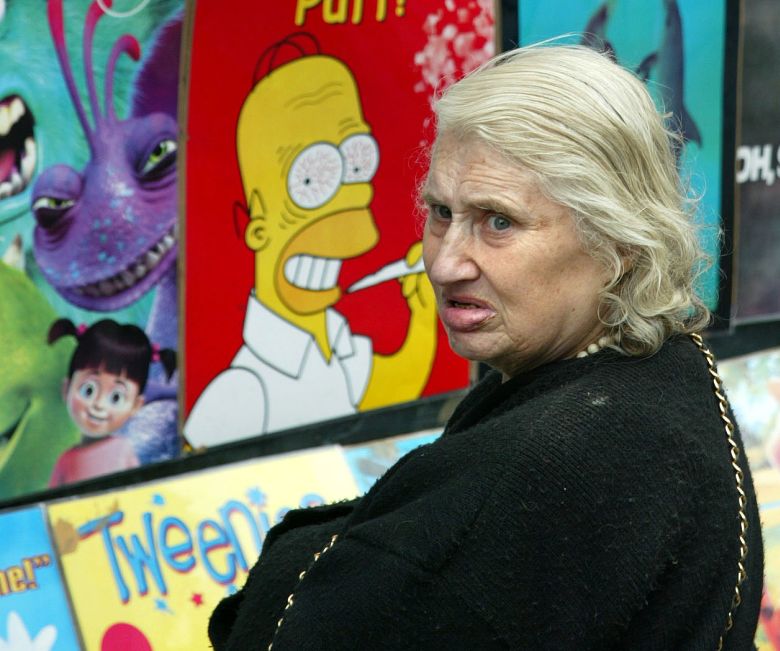 Una Taaffe at a poster display outside her shop in August 2002.