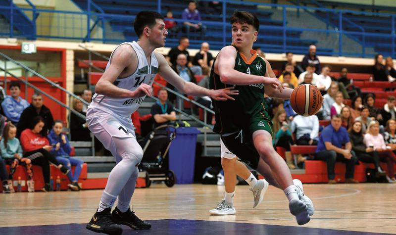 Paul Kelly of Moycullen takes on Adam Heaphy of Neptune during the Hula Hoops Under 20 National Cup semi-final at Neptune Stadium in Cork. Photo: Eóin Noonan/Sportsfile.