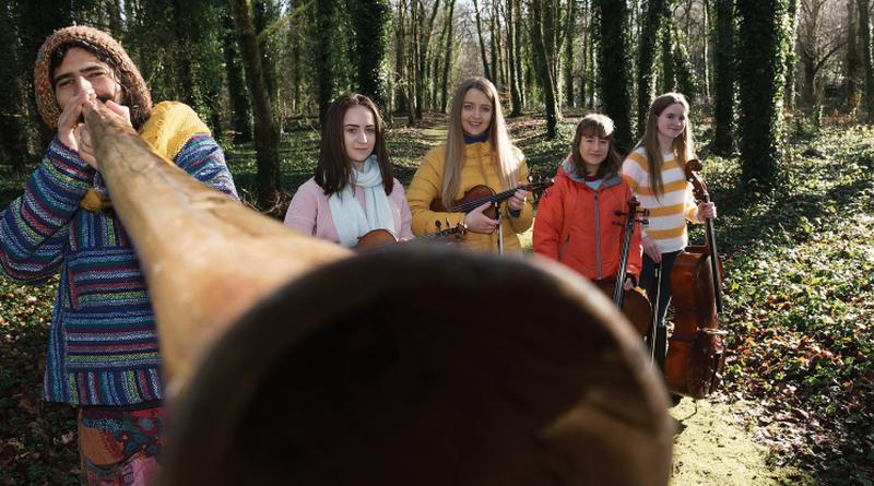 Itamar Meir on didgeridoo with members of the Coole Music Youth Orchestra (from left) Clidna Flaherty (violin), Roisin Clancy (viola), Caolainn Feeney and Naima Baker (both cello) pictured at the Walled Garden in Coole Park, preparing for A World of Music, the Coole Music Orchestra Festival on Saturday, March 10, in Gort. Photo: Andrew Downes, XPOSURE