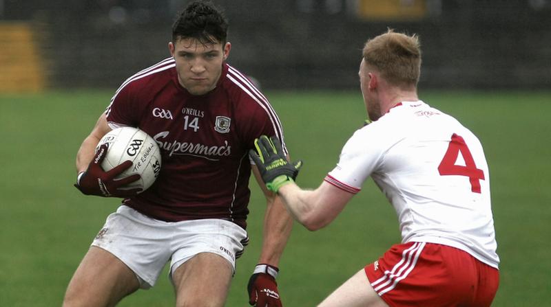 New Galway captain and Man of the Match Damien Comer takes on Tyrone’s Hugh Pat McGeary during Sunday's National Football League tie at Tuam Stadium. Photo: Enda Noone.