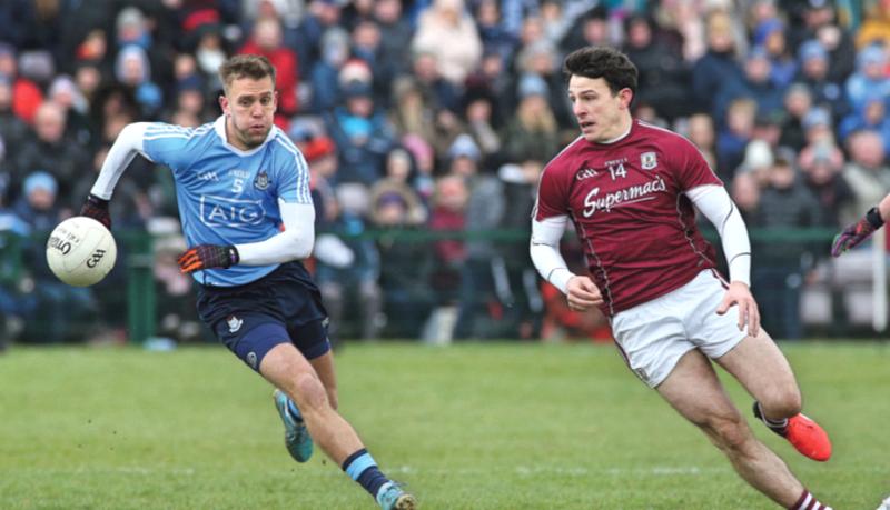 Galway's Séan Armstrong and Dublin's Jonny Cooper chase this loose ball during Sunday's National League tie at Pearse Stadium. Photos: Joe O'Shaughnessy.