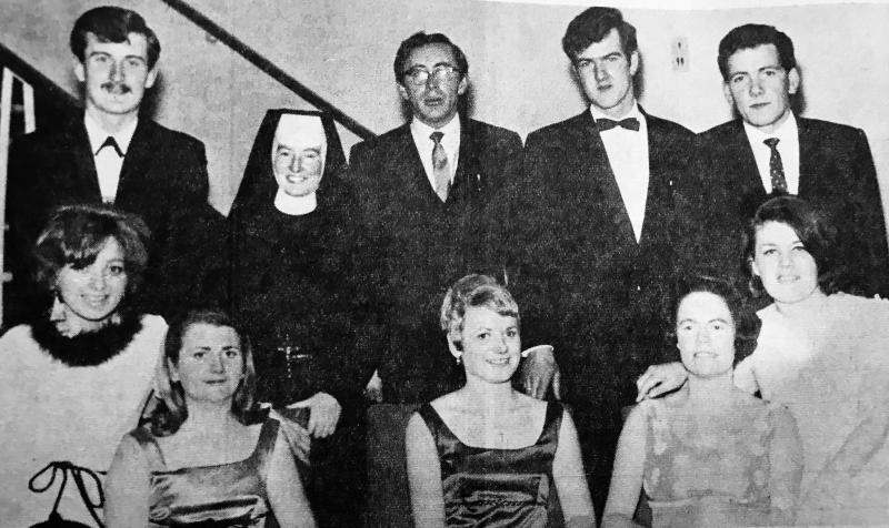 The organising committee of the St. Joseph's College, Carna P.P.U. dinner in the Great Southern Hotel, Galway in January 1969, were (seated, from left): Aileen Geoghegan (secretary), Bairbre Ní Ghaora, Bríd Ní Ghaora, Máire Bean Ní Ghaora (Patron), Gabrielle Nic Fhlannchadha (Treasurer). Standing: Padraig Mac Oireachtaigh, Rev. Sister Pius, Sean Ó Ceoinn (chairman), Michael Mac Oireachtaigh and Martias De Burca.