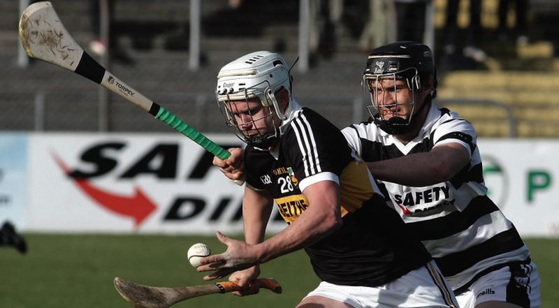 Beagh’s Damien Landers comes under pressure from Turloughmore's Ronan Burke in Kenny Park on Saturday.