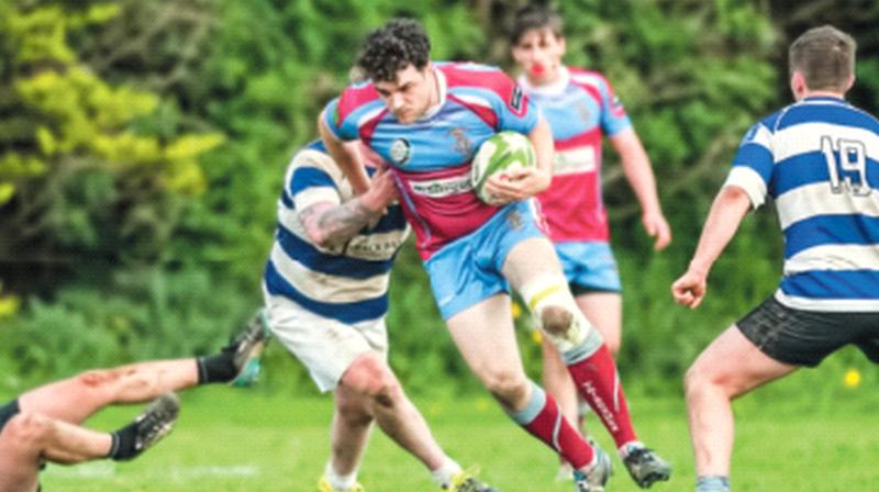 Tribesmen's Toto McCabe making some hard yards against Athy Sharks.