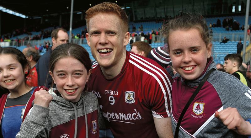 Galway’s Man of the Match Ciarán Duggan celebrates with supporters, Ciara Devine (left) and Maria Fitzpatrick, both from Annaghdown, aftertheir Connacht football championship victory over Mayo in Castlebar on Sunday. Photo: Joe O'Shaughnessy.