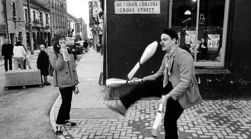 A juggler performing at the junction of Quay Street-Cross Street in Galway in the 1990s.